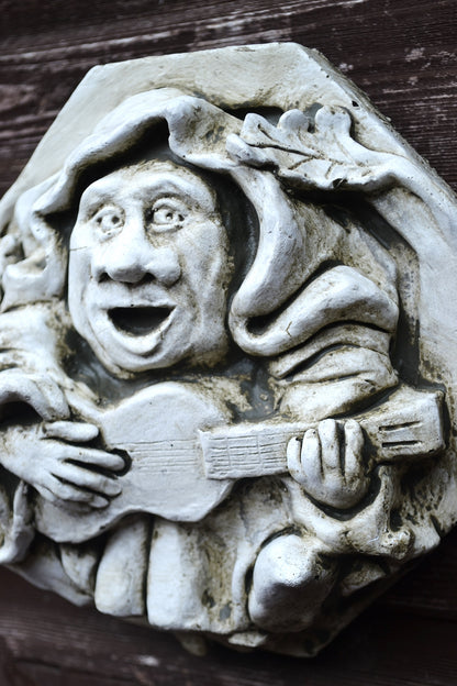 Guitar playing Medieval Monk
